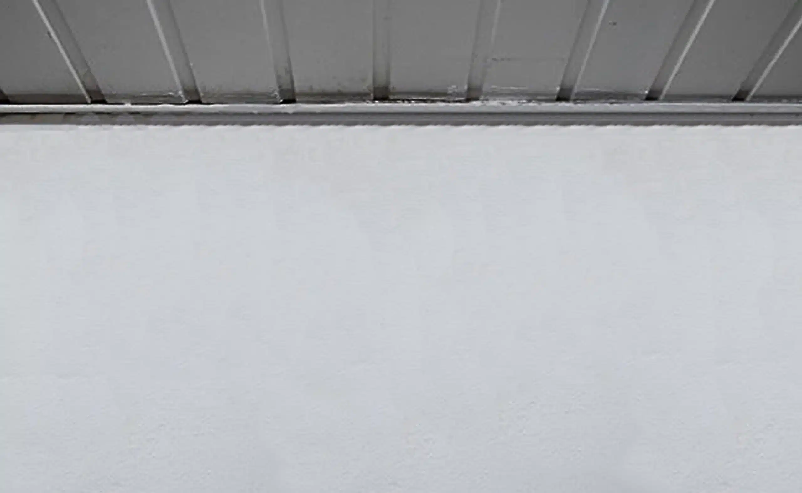 Basement after mold remediation — clean ceiling and wall